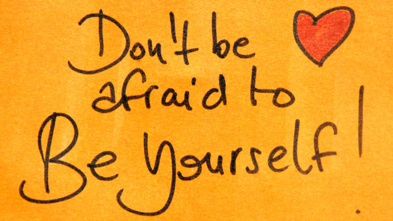 Post it note with a heart and the words, Don't Be Afraid To Be Yourself